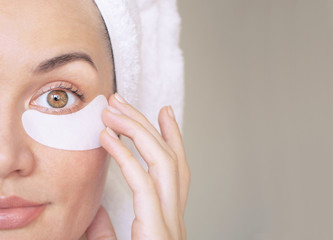 girl with patches under the eyes from wrinkles