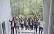 © saksit - Group of asian business team raising arms success achievement Concept