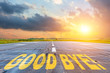 © aapsky - Good luck written on runway road airport at sunset