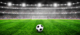 Fototapeta Sport - Soccer ball on stadium with illumination