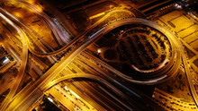 Aerial Drone Night Shot Of Multilevel Junction Highway With Moderate Traffic
