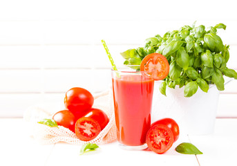 Fresh tomato juice on white background. 