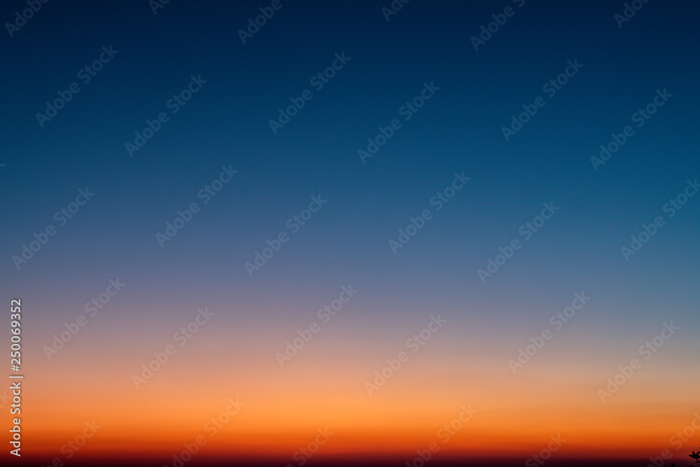Sky gradient from blue to orange sunset - obrazy, fototapety, plakaty 