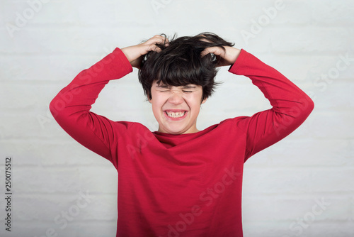 Boy Scratching His Hair For Head Lice Buy This Stock Photo And