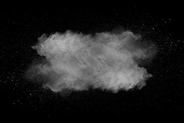 Wall Mural - Explosion of white dust on black background.