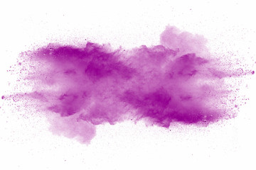 Wall Mural - Explosion of violet dust on white background.