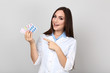 © 5second - Young doctor holding blister packs on grey background