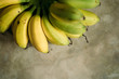 © lockyfoto - fresh mini bananas on the grey background