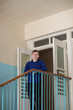 © artem - the guy in the blue shirt at the stair railing with the doors open in the background