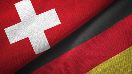 Wall Mural - Switzerland and Germany two flags textile cloth, fabric texture