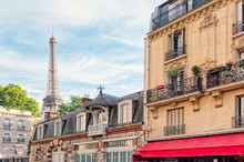 Ornate Apartment Buildings And Eiffel Tower In Paris
