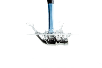 Poster - A hammer falling into the water. Hammering the water with a hammer and a great splash of water. The concept of failure, the impossibility of reaching an agreement. Construction renovation.