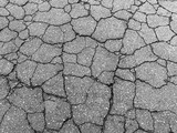 Fototapeta Nowy Jork - Gray street texture with many cracks and holes