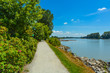 © Imagenet - Walk way on river side close to the water. Fraser river side path in Vancouver, British Columbia. Peace of mind view