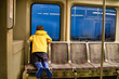 © EvgeniiAnd - boy in the subway train looks out the window. child rides on the subway. Copy space for your text
