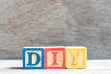 Canvas Print - Color letter block in word DIY (abbreviation of do it yourself) on wood background