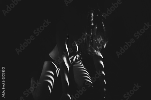 Valokuvatapetti Beautiful body girl in the white line on a black background.