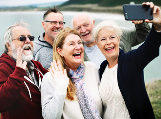 Group of happy seniors taking a selfie