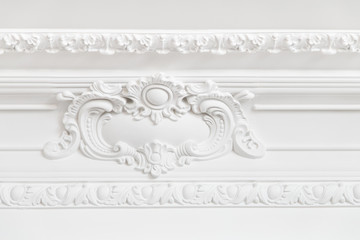 Wall Mural - Beautiful ornate white decorative plaster moldings in studio