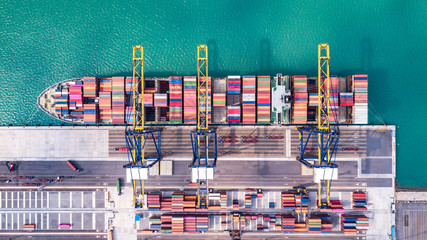 Cargo ship loading and unloading goods at the deep sea port