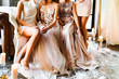 Bride and bridesmaids on the sofa