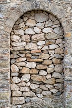Ancient Stone And Old Wall With An Arch In A Niche Closeup For A Background Or For Wallpaper