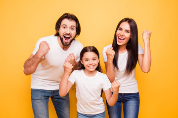 Wall Mural - Portrait of nice lovely attractive charming cheerful cheery glad people mom dad pre-teen girl showing winning gesture yes breakthrough isolated over shine vivid pastel yellow background