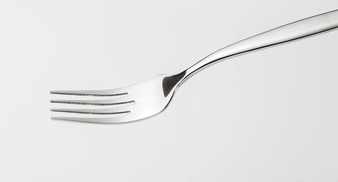 Fototapete - A fork on white background