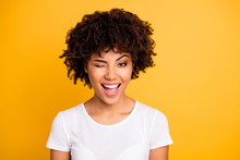 Close Up Photo Pretty Amazing She Her Dark Skin Lady Cool Look Glad Winking One Eye Mouth Open Laugh Laughter Wearing Casual White T-shirt Isolated Yellow Bright Vibrant Vivid Background