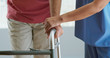 © rocketclips - Close up on hands of physical therapist or doctor helping older male patient learn to walk with a walker. Female nurse assisting senior man with recovery after surgery