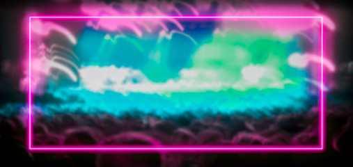 Wall Mural - Pink and turquoise neon light frame with crowd at festival concert in the background. Copy space for text or product display.