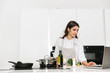 © Drobot Dean - Beautiful young woman cooking healthy dinner
