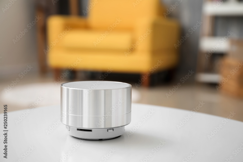 Smart home assistant device on table in room