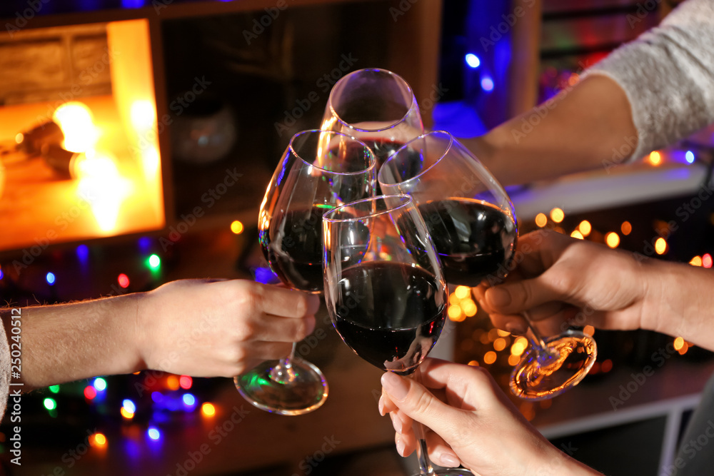 Women clinking glasses with tasty wine in bar
