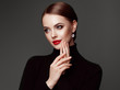 © Oleg Gekman - Beautiful Young Woman with Clean Fresh Skin. Perfect Makeup. Beauty Fashion. Red Lips. Cosmetic Eyeshadow. Smooth Hair. Girl in Black Turtleneck
