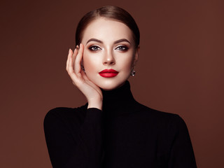 Wall Mural - beautiful young woman with clean fresh skin. perfect makeup. beauty fashion. red lips. cosmetic eyes