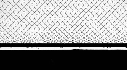 Wall Mural - close up damaged wire mesh background - silhouette