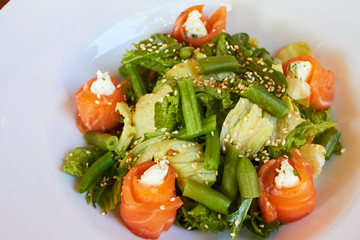 Wall Mural - Salad with salmon, asparagus and melted cheese. sprinkled with sesame