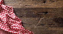 Red Checkered Kitchen Tablecloth On Rustic Wooden Table