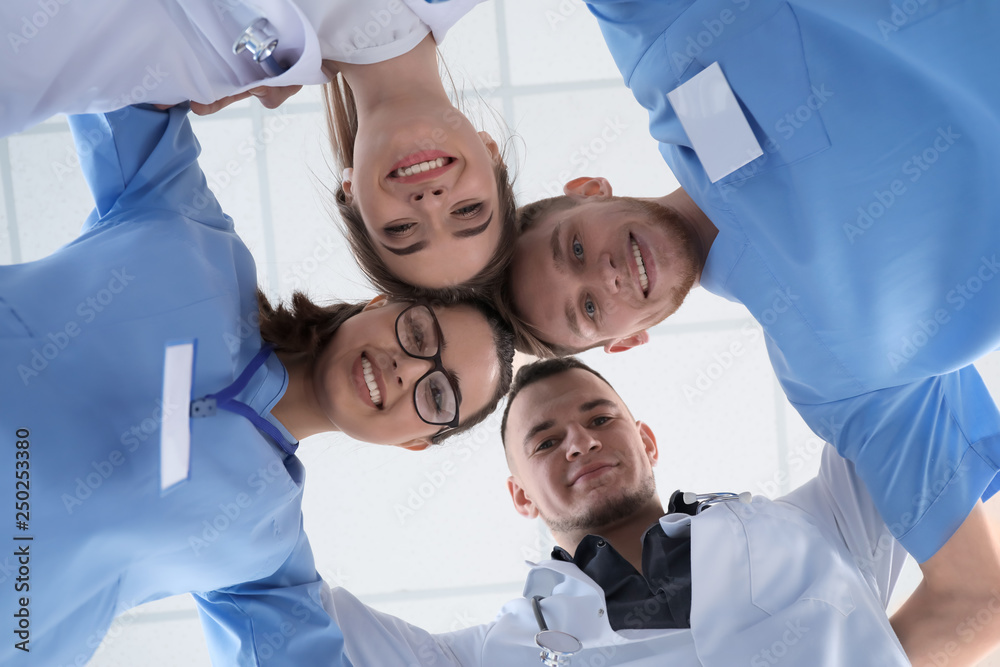 Team of doctors in clinic, bottom view
