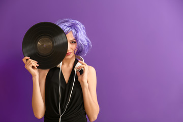 Sticker - Beautiful young woman with vinyl disk and headphones on color background