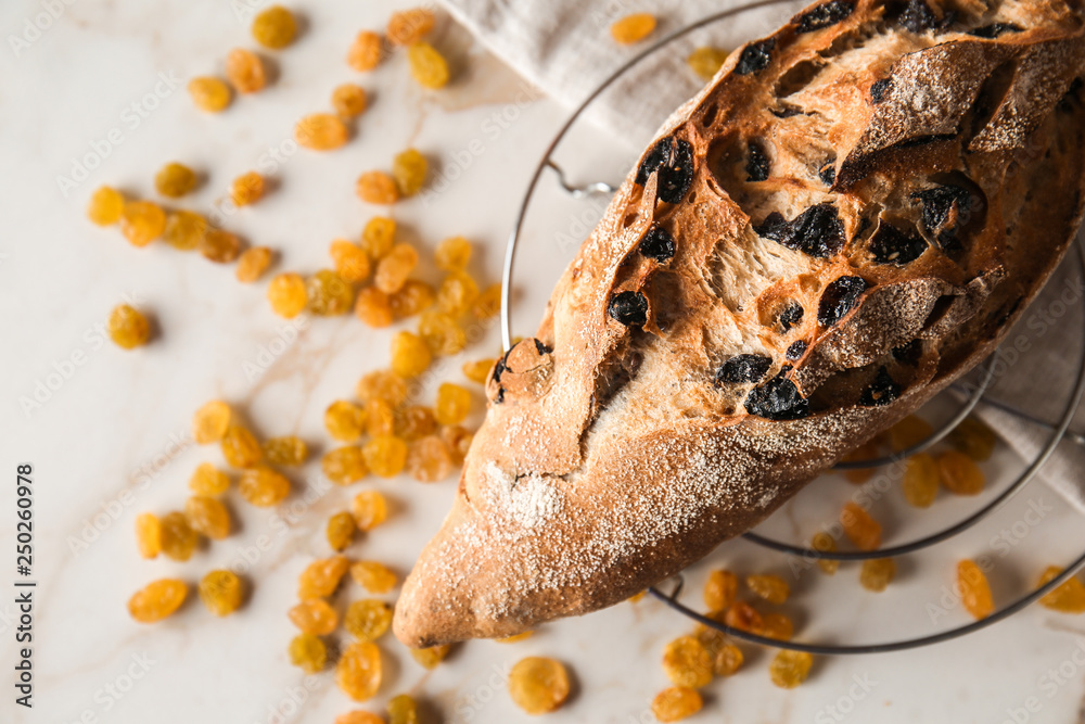 Loaf of fresh bread on cooling rack