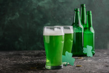 Glasses Of Green Beer On Grunge Table. St. Patrick's Day Celebration
