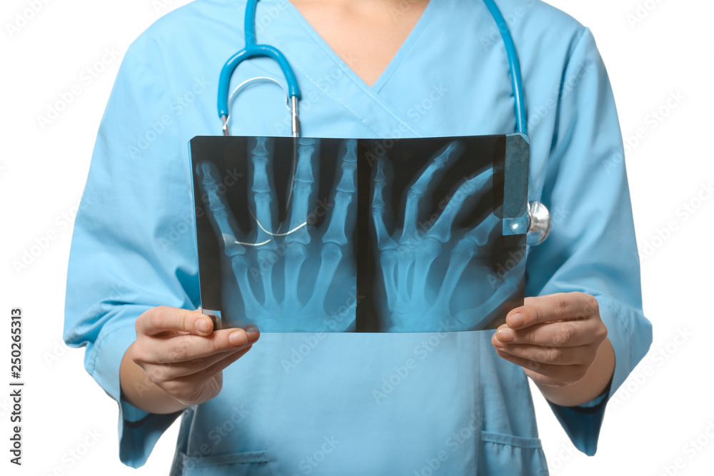 Female doctor studying X-ray image on white background