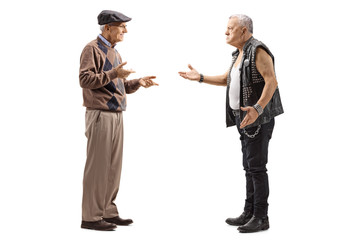 Senior man talking to a mature male punker