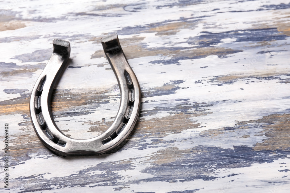 Horseshoe on wooden table. St. Patrick's Day celebration