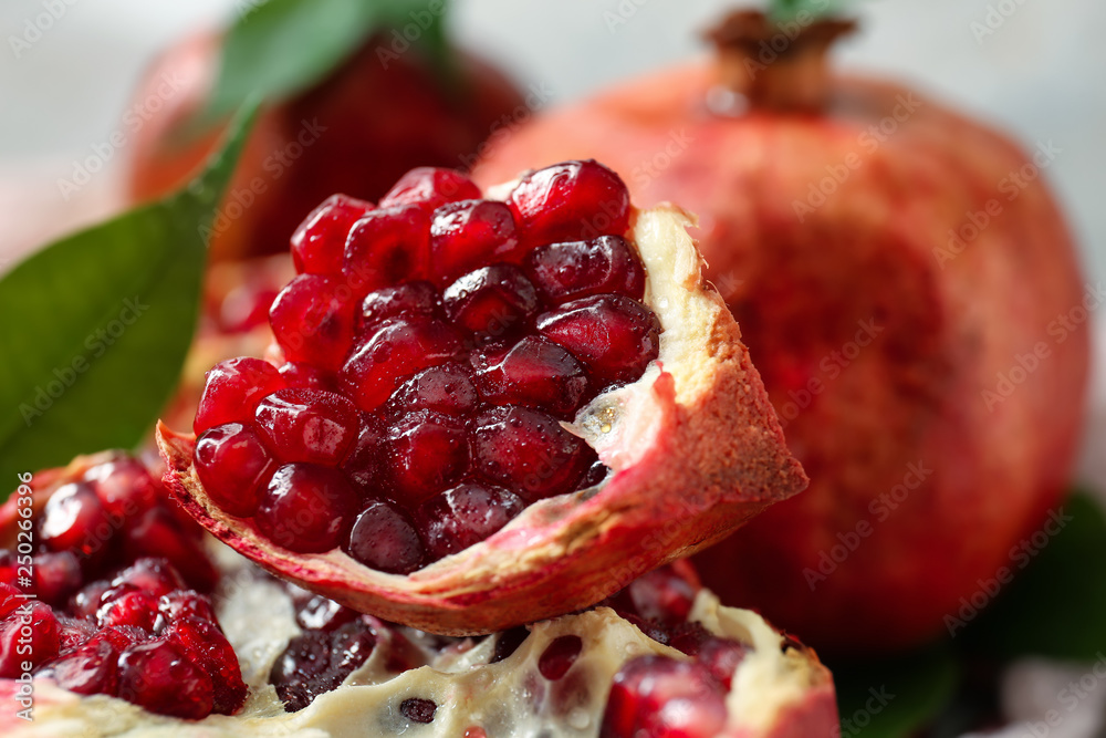 Pieces of tasty pomegranate on table, closeup