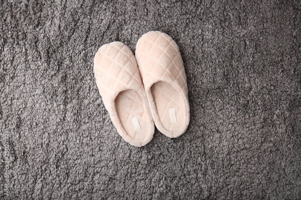 Soft slippers on fluffy carpet