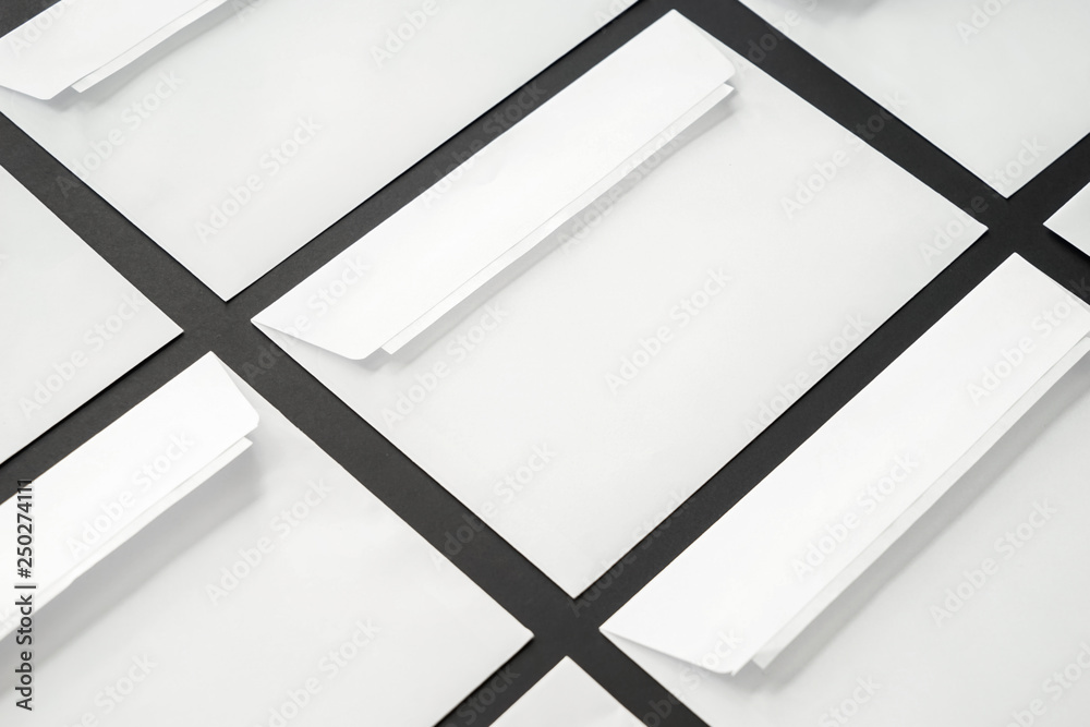 Many blank envelopes on dark background