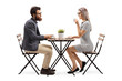 © Ljupco Smokovski - Young man and woman drinking coffee at a table